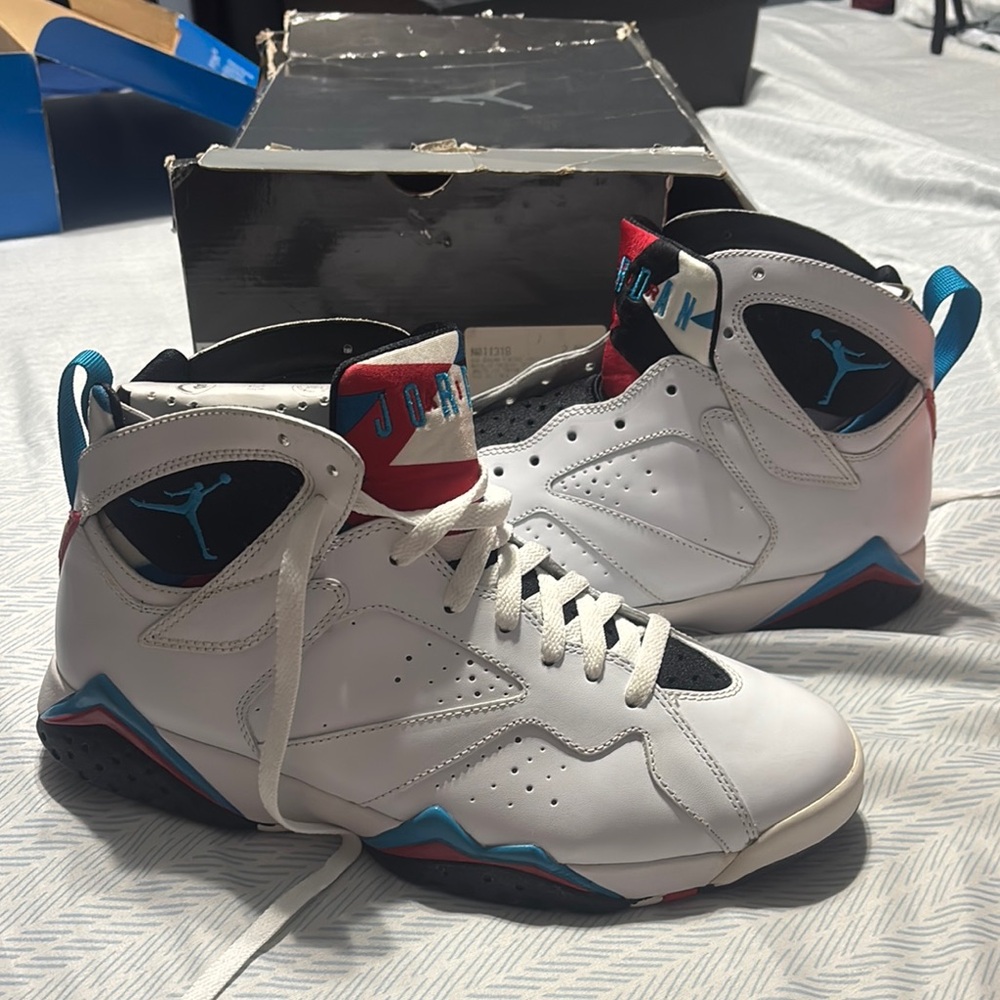 Jordan White and Blue Sneakers with Cross-Strap Design